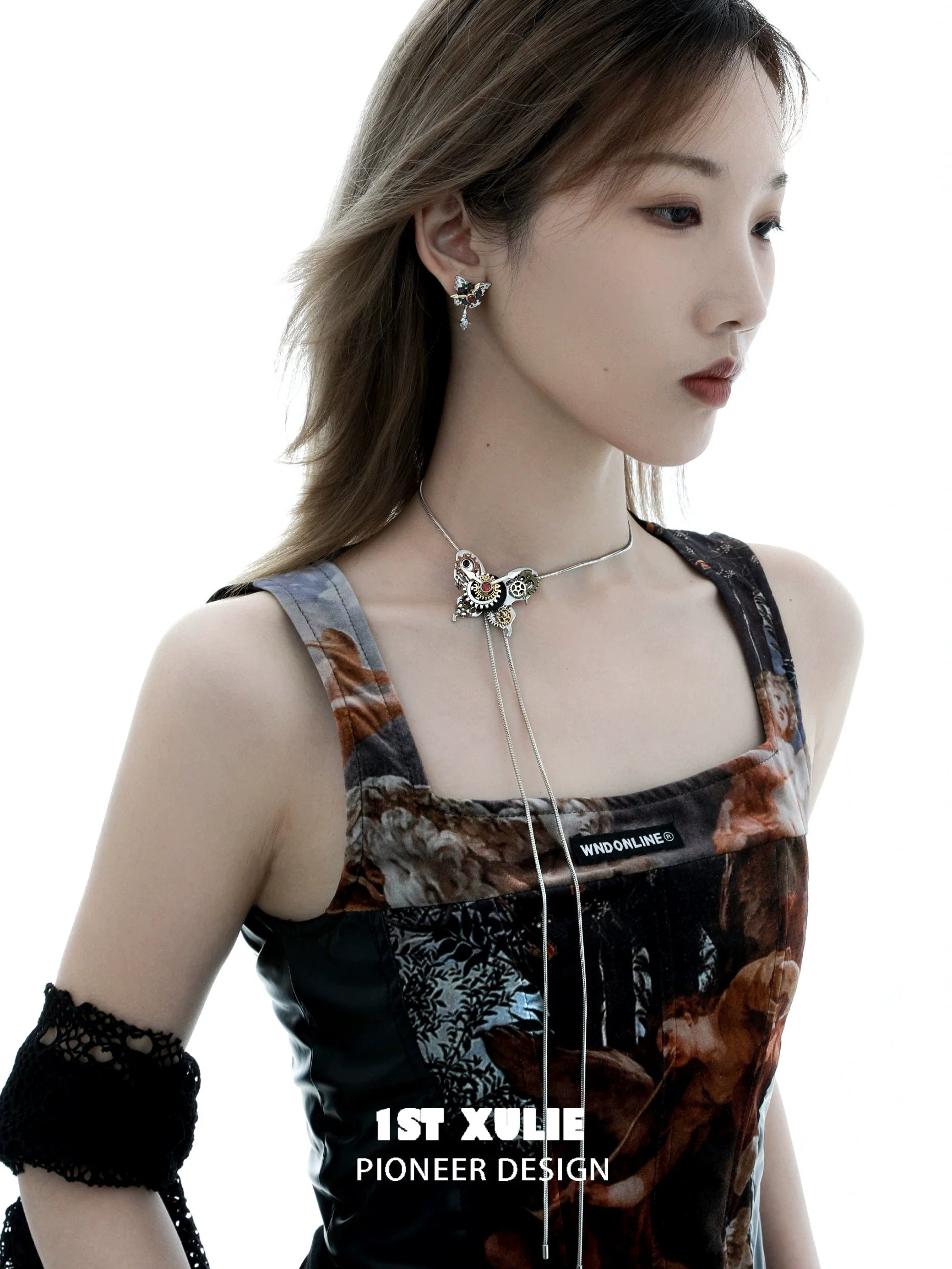 Stylish model wearing a cyber butterfly necklace from 1STXULIE showcasing a unique design