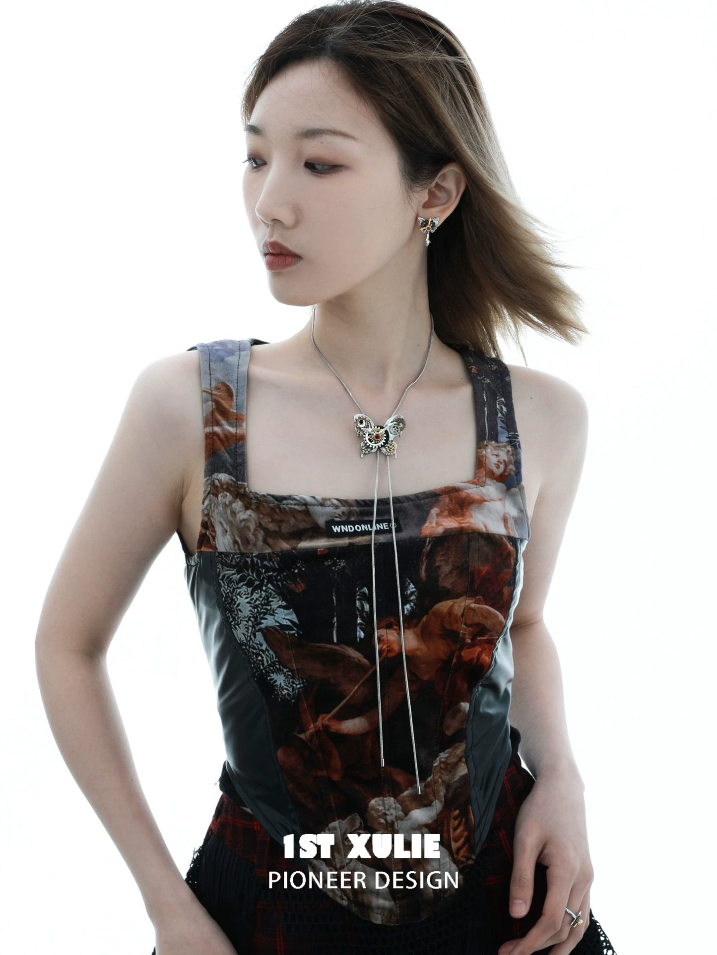 Model wearing a stylish outfit with a cyber butterfly necklace for a modern look