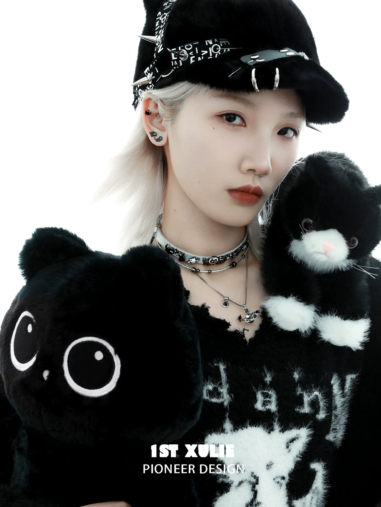 Trendy model showcasing Y2K black cat earrings with plush cats for a stylish urban look