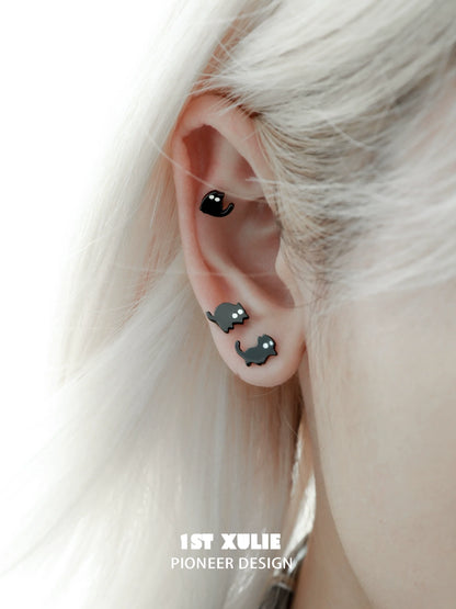 Y2K black cat earrings stylishly displayed on a model's ear with a trendy hairstyle