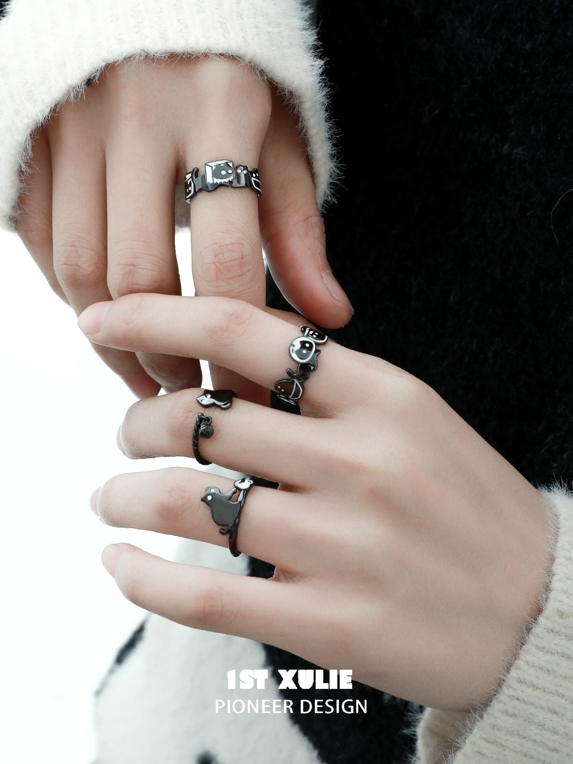Y2K black cat ring showcased on fingers with stylish silver accents for trendy fashion lovers
