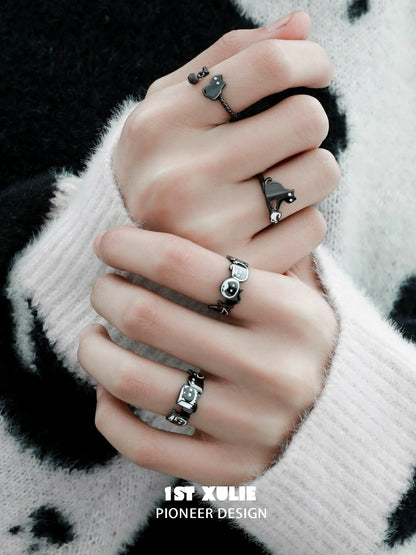 Stylish Y2K black cat ring showcased on fingers with various unique designs for trendy looks