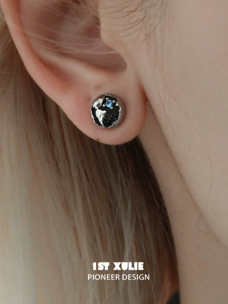 Y2K black silver stud earrings featuring a unique textured design and blue accents