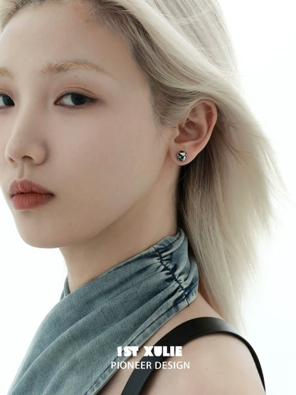 Model wearing Y2K black silver stud earrings showcasing a trendy design and modern aesthetic