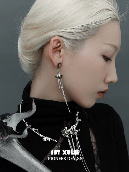 Y2K blood mandala tassel earrings featuring intricate design and modern aesthetic worn by a model