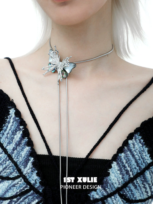 Y2K butterfly necklace with silver accents and a unique design worn on a model