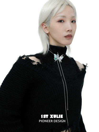Y2K butterfly necklace featured on a model wearing a black sweater with a stylish design