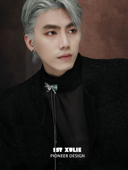 Y2K butterfly necklace styled on model with silver hair and sleek fashion ensemble