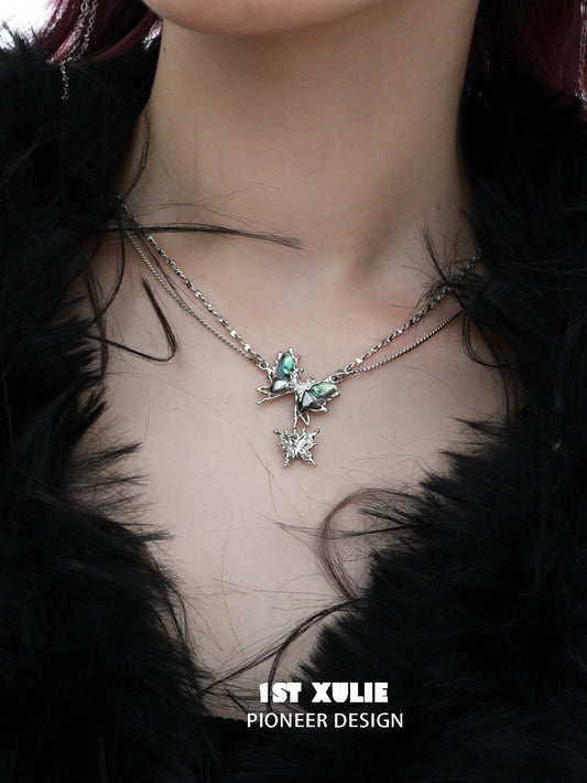 Y2K butterfly necklace from 1ST XULIE with layered silver chains and decorative butterfly charm