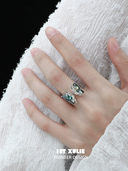 Y2K butterfly silver ring featuring colorful butterfly designs on a stylish hand