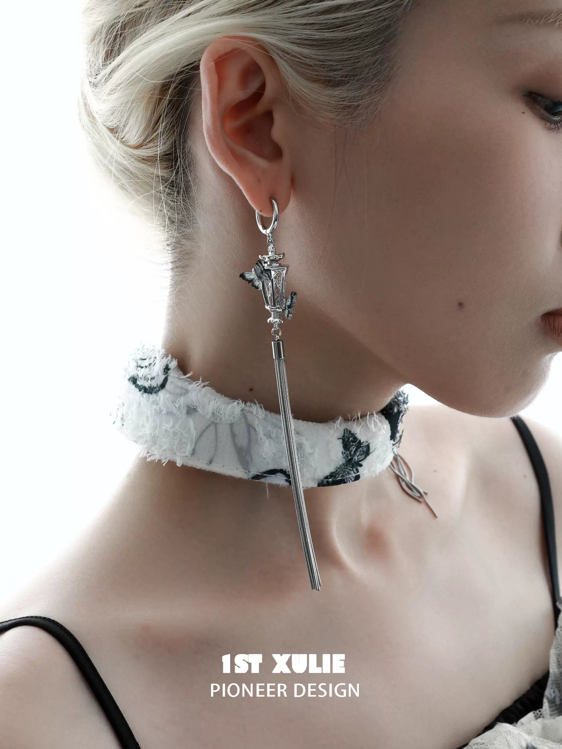 1STXULIE Y2K butterfly tassel earrings with a unique design worn by a model in a stylish setting