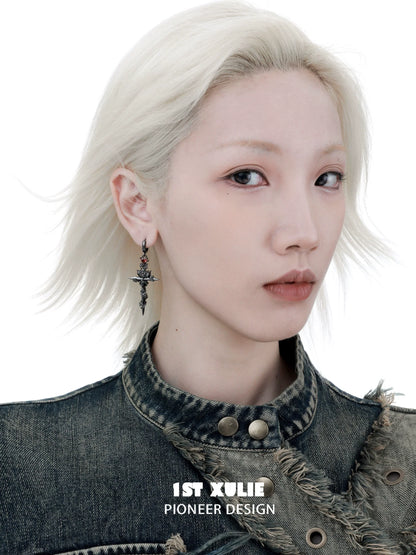 Model wearing Y2K gothic cross earrings with a punk-inspired outfit and platinum hair