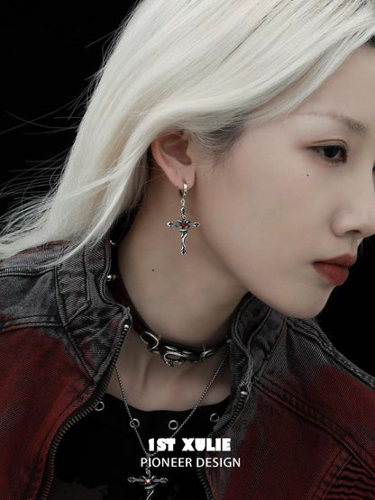 Y2K gothic cross earrings worn by a model with silver hair for a trendy look