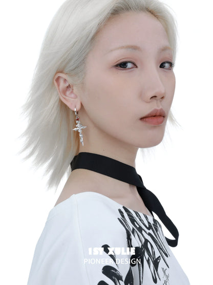 Y2K gothic cross earrings hanging delicately with a stylish design, perfect for modern fashion enthusiasts
