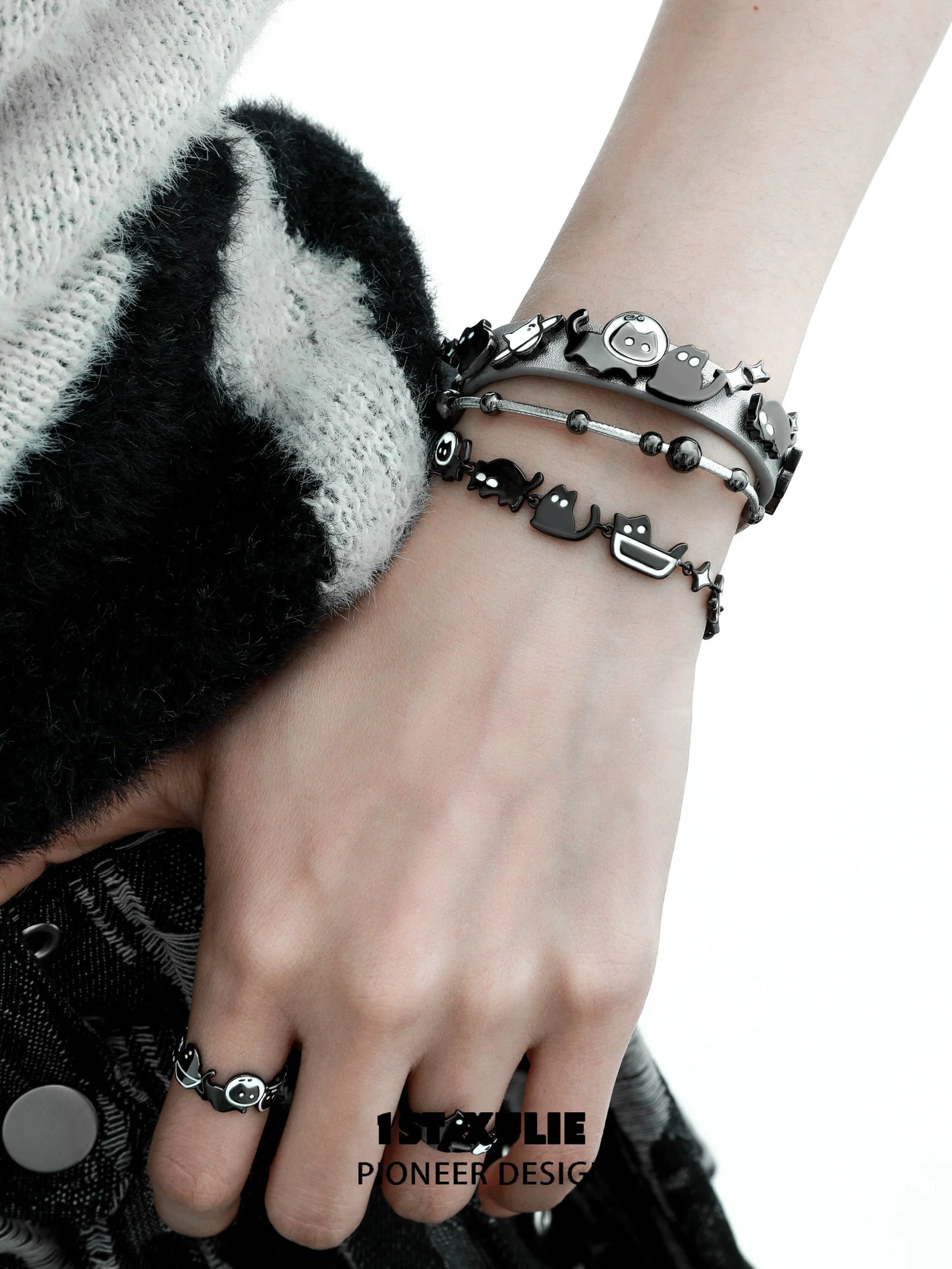 Y2K kitty leather bracelet featuring playful cat charms and stylish black design.