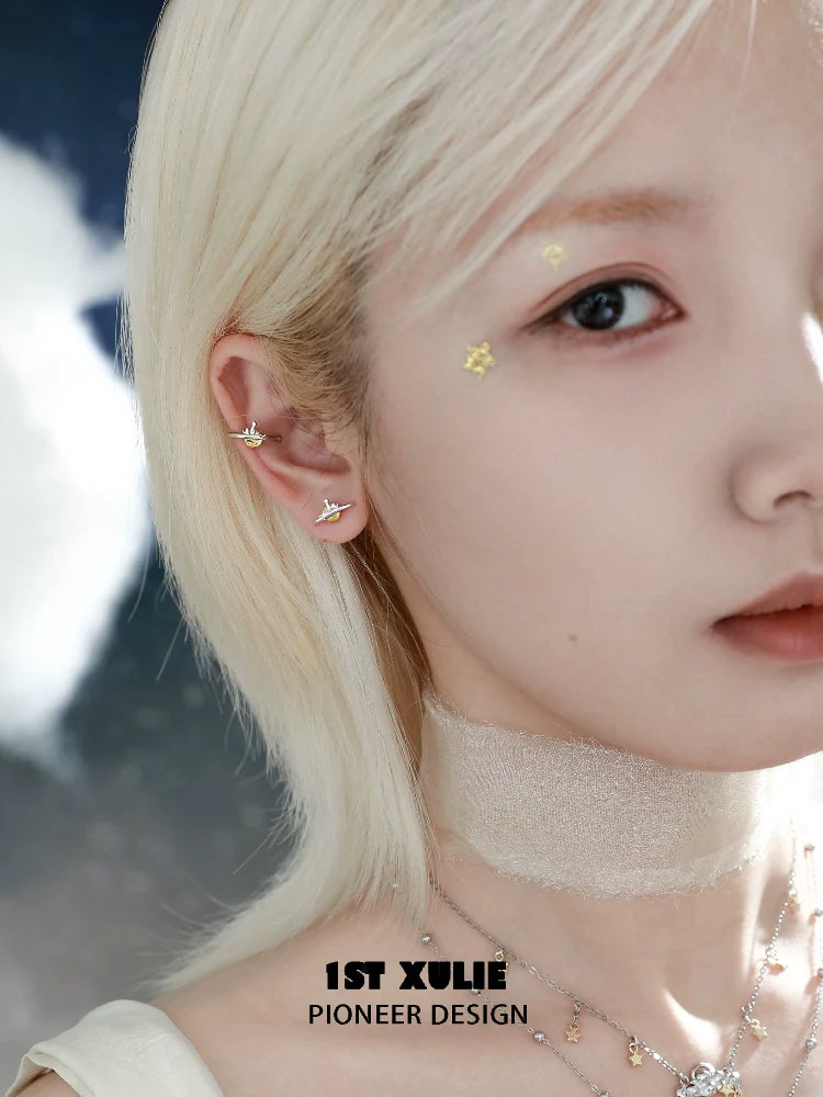 1ST XULIE Y2K lonely dreamer earrings showcased on a model with light blonde hair and subtle makeup