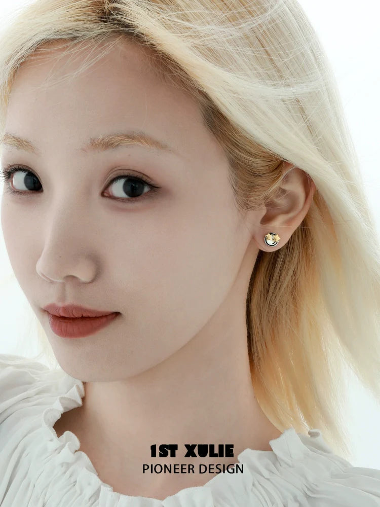Y2K mood diary stud earrings designed by 1STXULIE showcased on a model with blonde hair