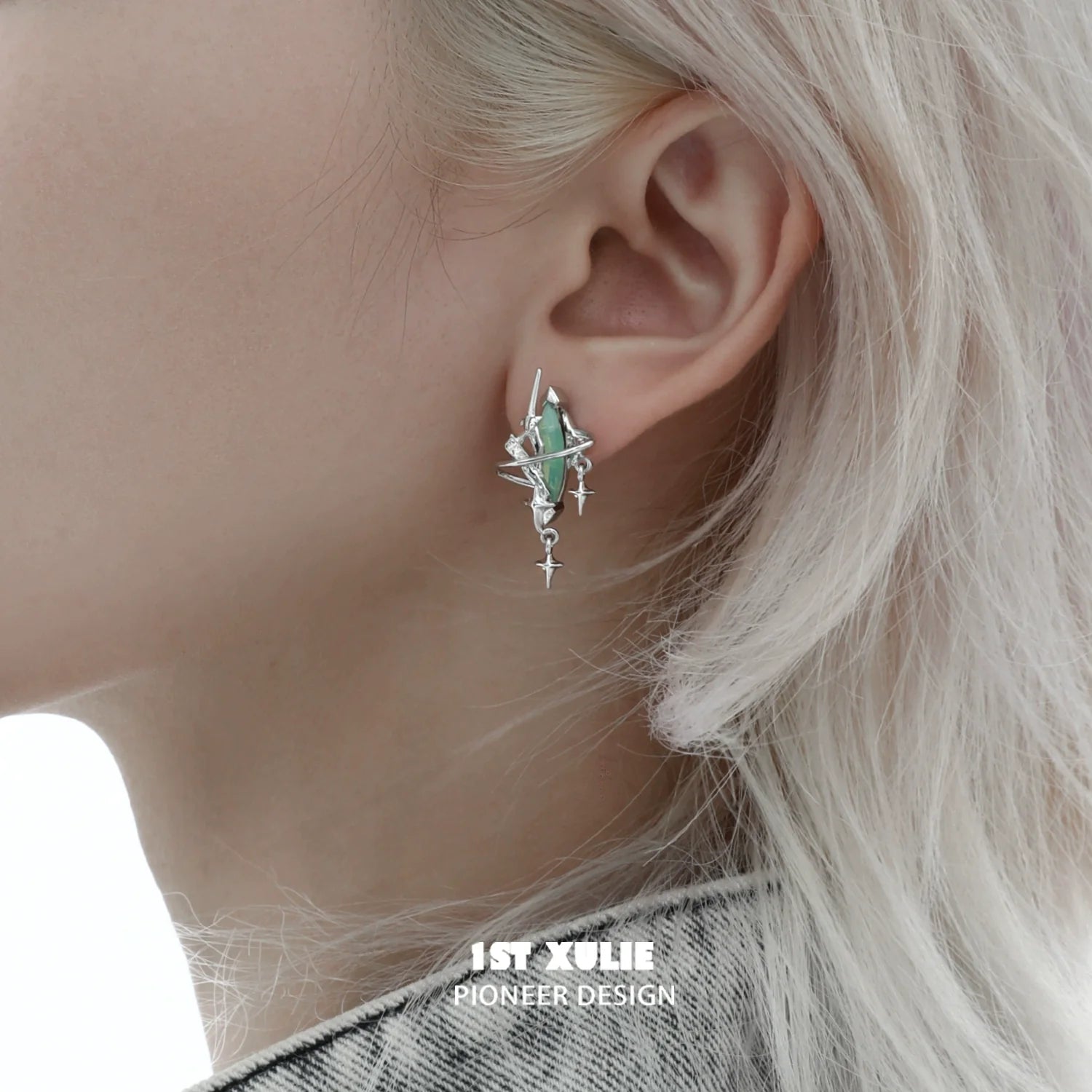 Y2K mystic earrings featuring a unique design with green gemstones and silver accents