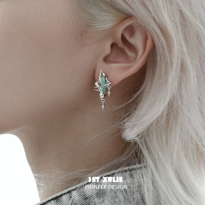 Y2K mystic earrings featuring a unique design with green gemstones and silver accents