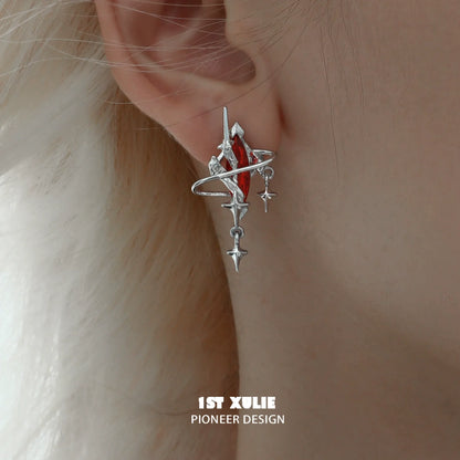 Silver Y2K mystic earrings with celestial design and red accents for a trendy statement