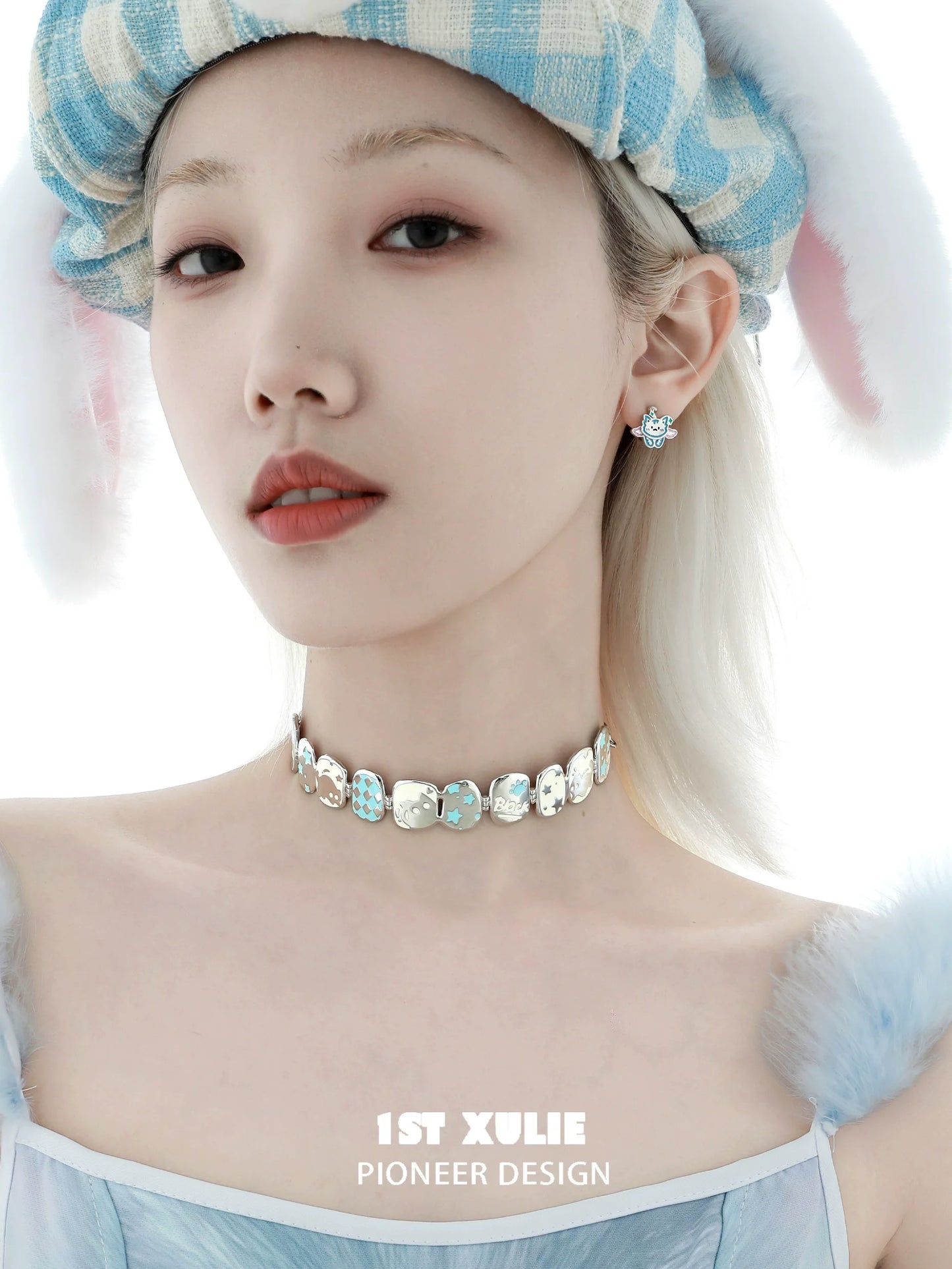 Close-up of a model wearing a Y2K owl choker necklace with matching earrings and unique style