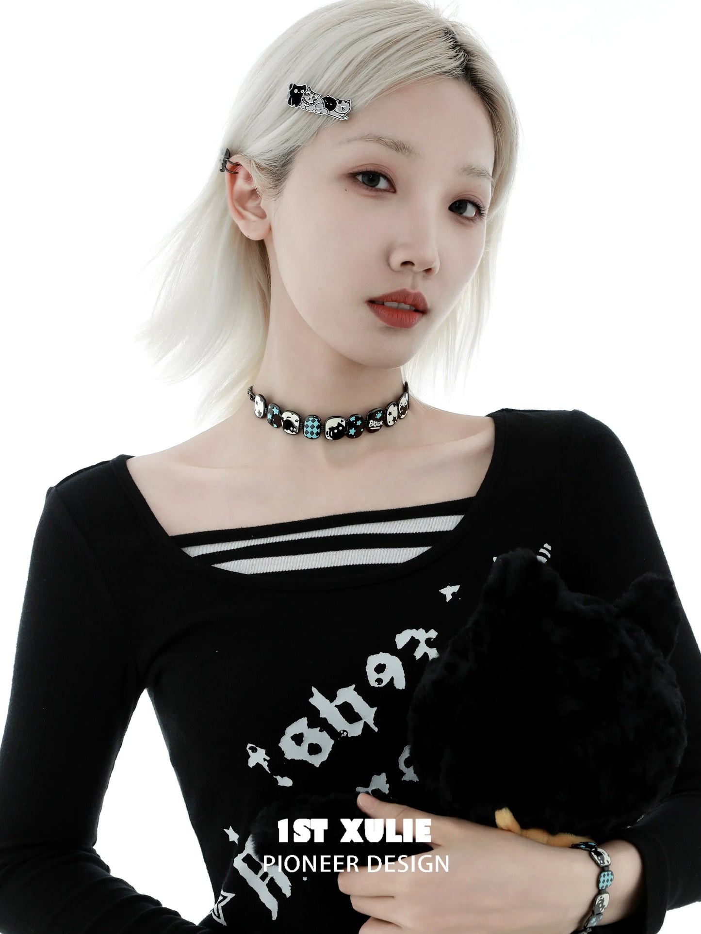 Trendy Y2K owl choker necklace worn by model with stylish black shirt and hair accessories