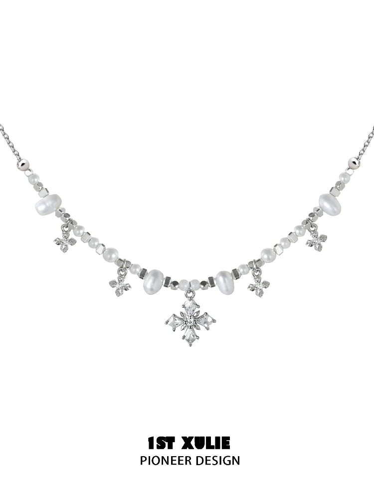 Y2K pearl necklace with silver accents and sparkling gemstones for a vintage-inspired look