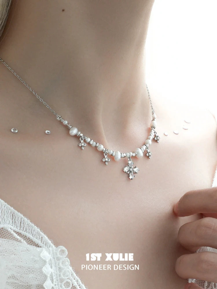 Y2K pearl necklace featuring delicate silver accents and floral designs for a trendy look