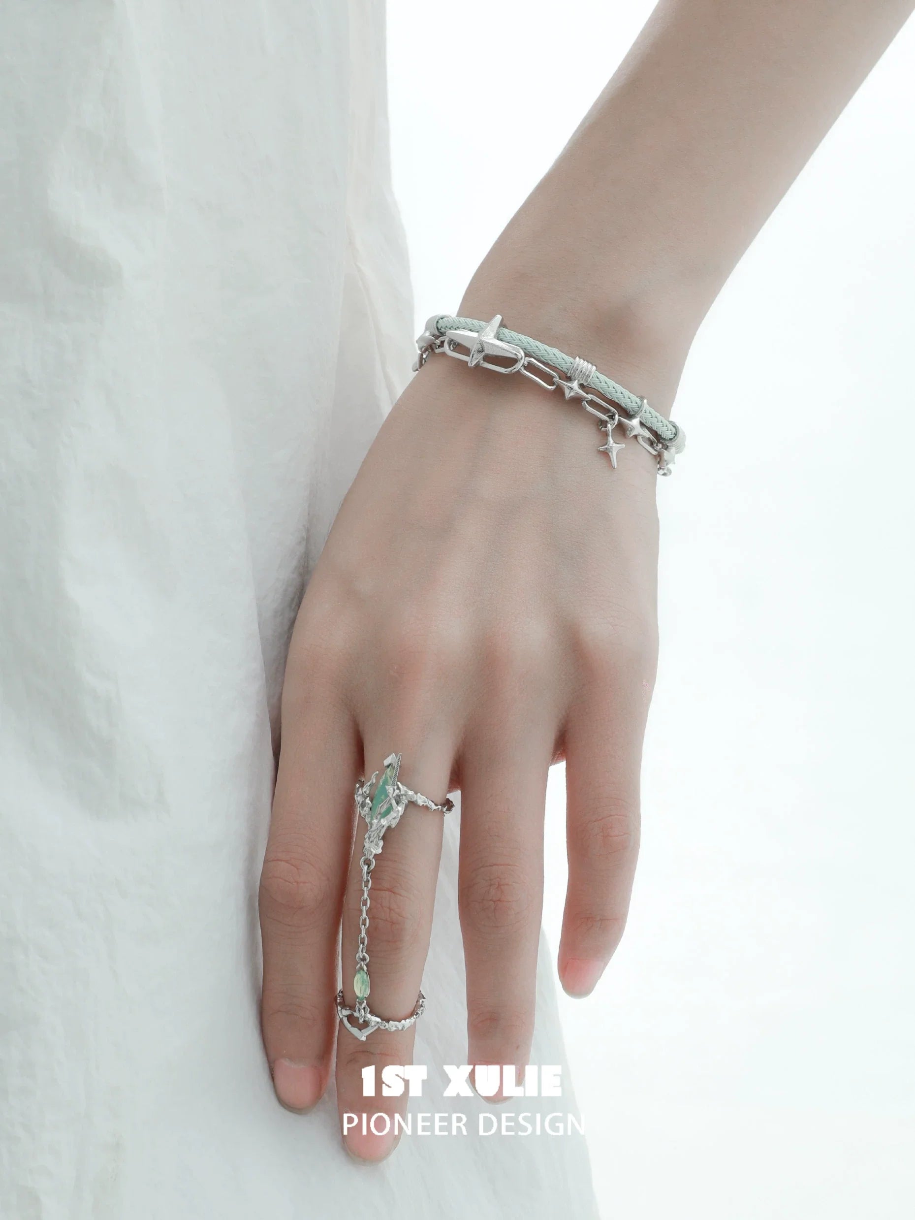 Trendy Y2K punk silver ring displayed on a hand with a silver bracelet for fashion enthusiasts