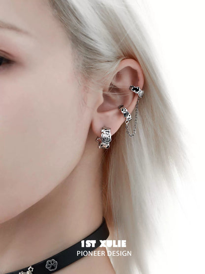 Y2K puppy chain earrings showcasing a unique design on a model's ear with silver detailing