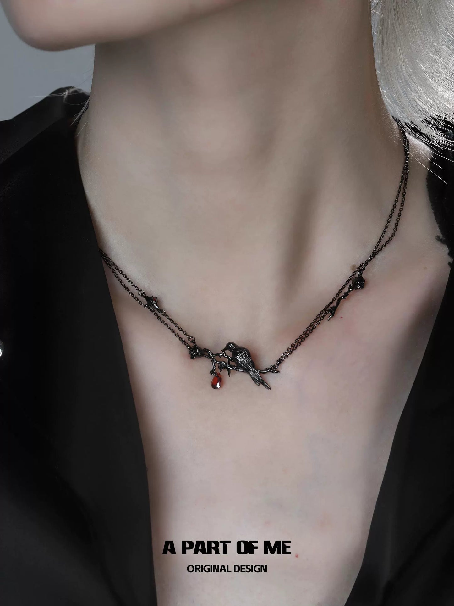 Y2K raven rose necklace from A PART OF ME featuring intricate charms and dark metal chains