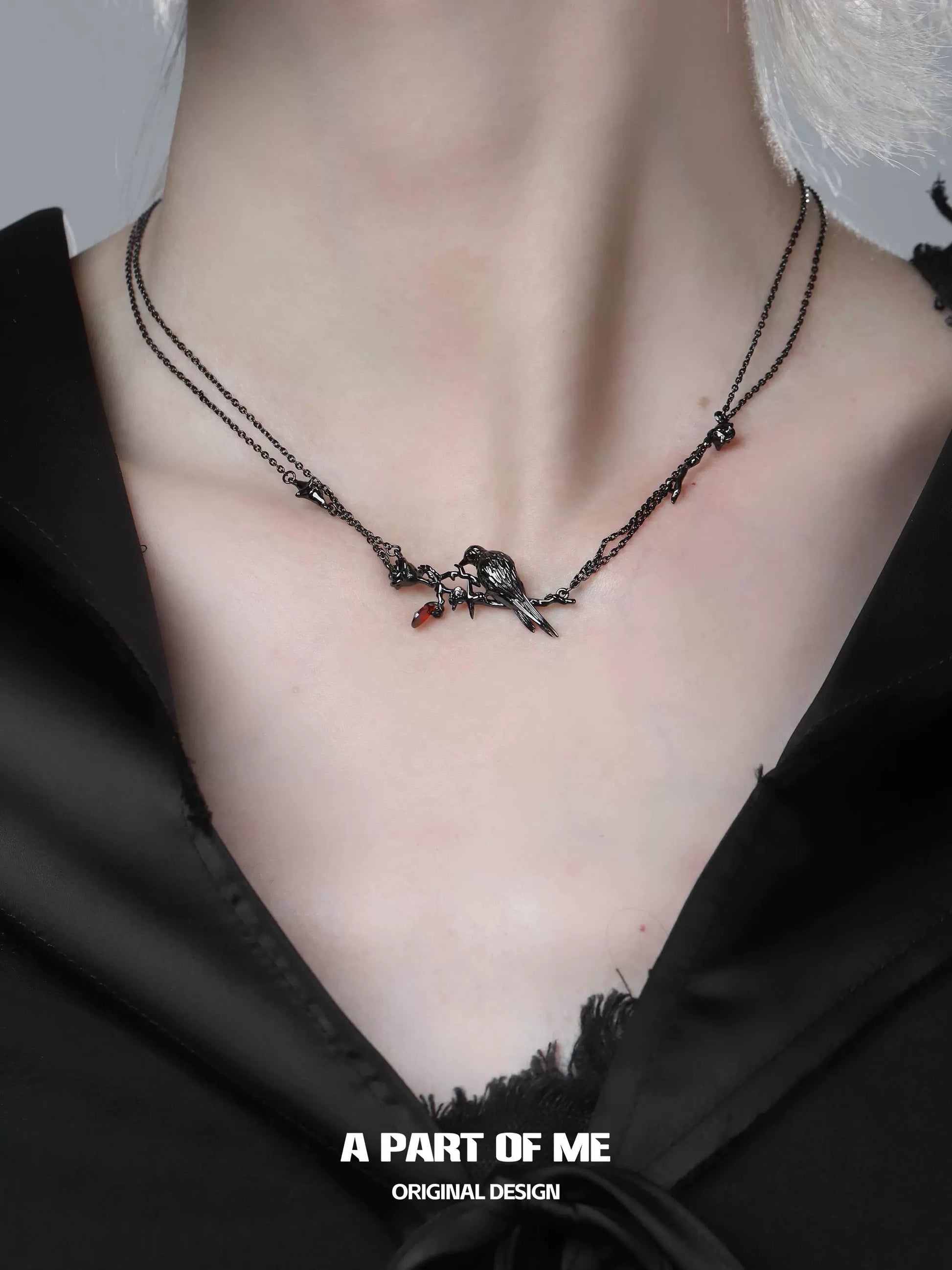 Y2K raven rose necklace displayed on a model, showcasing its unique design and dark aesthetic
