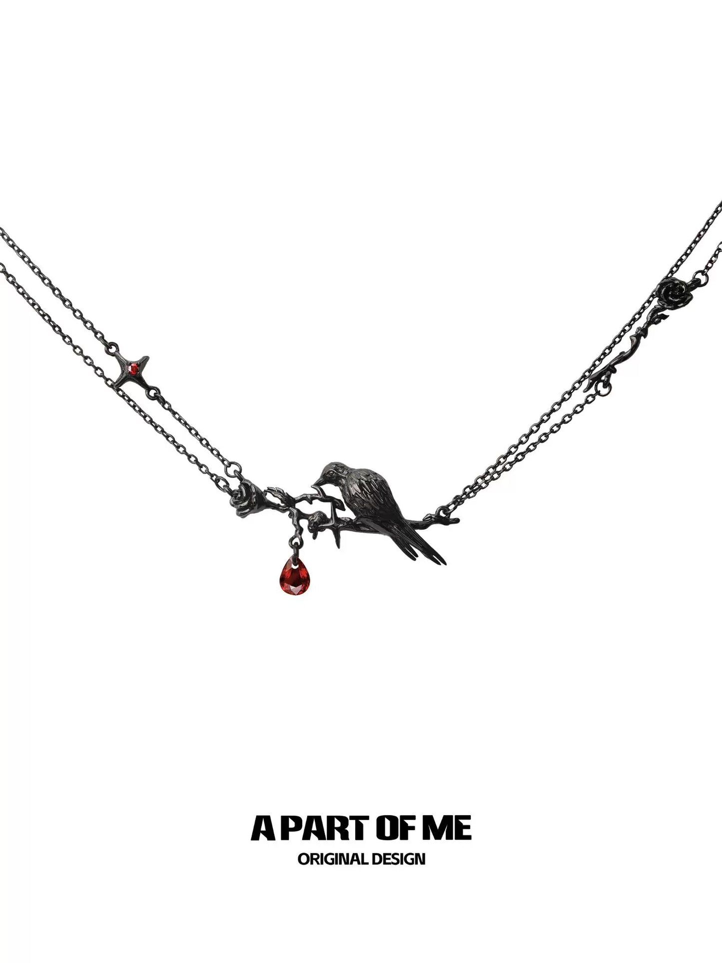 Y2K raven rose necklace featuring a bird perched on a branch with a red gemstone drop