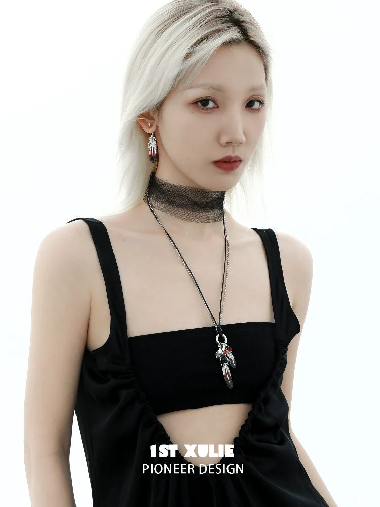 Y2K red witch feather necklace worn by a model with a chic outfit