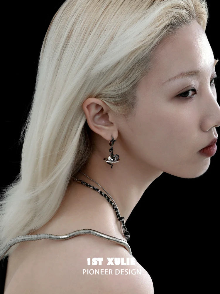Model wearing y2k snake earrings in a stylish design, showcasing unique fashion accessories