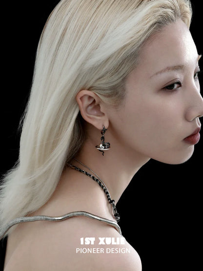 Model wearing y2k snake earrings in a stylish design, showcasing unique fashion accessories