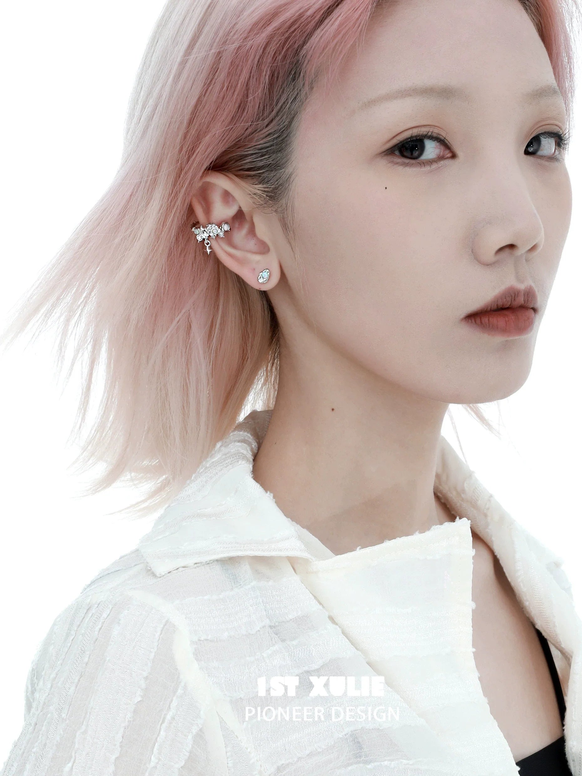 Model wearing Y2K thorned crown earrings with unique design and sparkling accents in a styled look