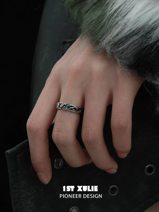Y2K viper ring featuring a sleek design with green accents, worn on a stylish hand