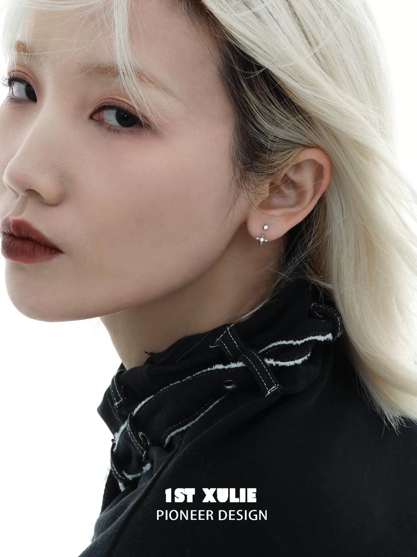 Stylish zircon ear studs for women showcased on a model with blonde hair and a chic black outfit