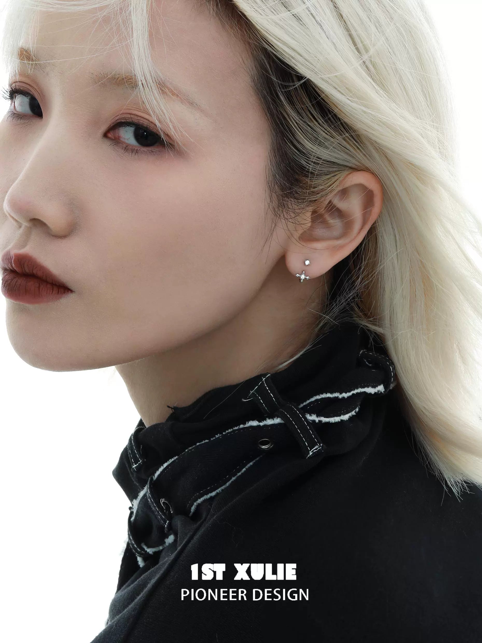 Stylish zircon ear studs for women showcased on a model with blonde hair and a chic black outfit